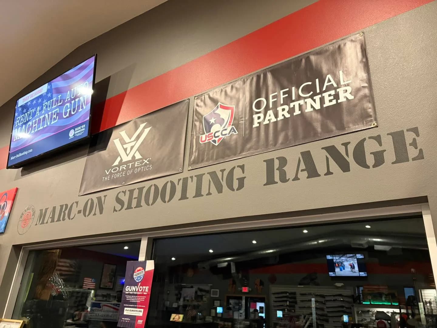 Marc-On Shooting range wall with partner banners and an in-range display screen