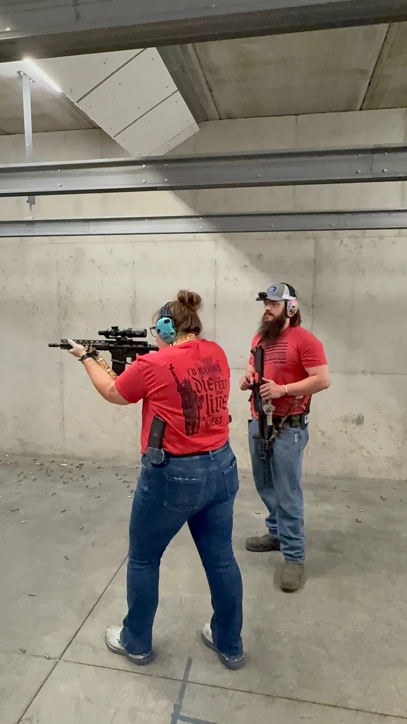 A Marc-On instructor coaching a rifle shooter on the indoor range