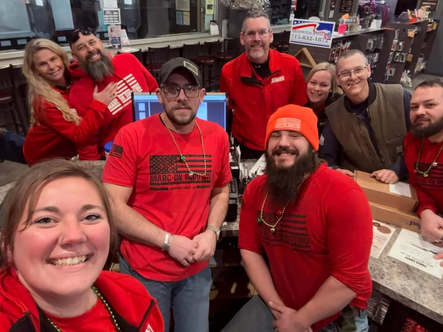 The Marc-On Shooting team gathered inside the pro shop