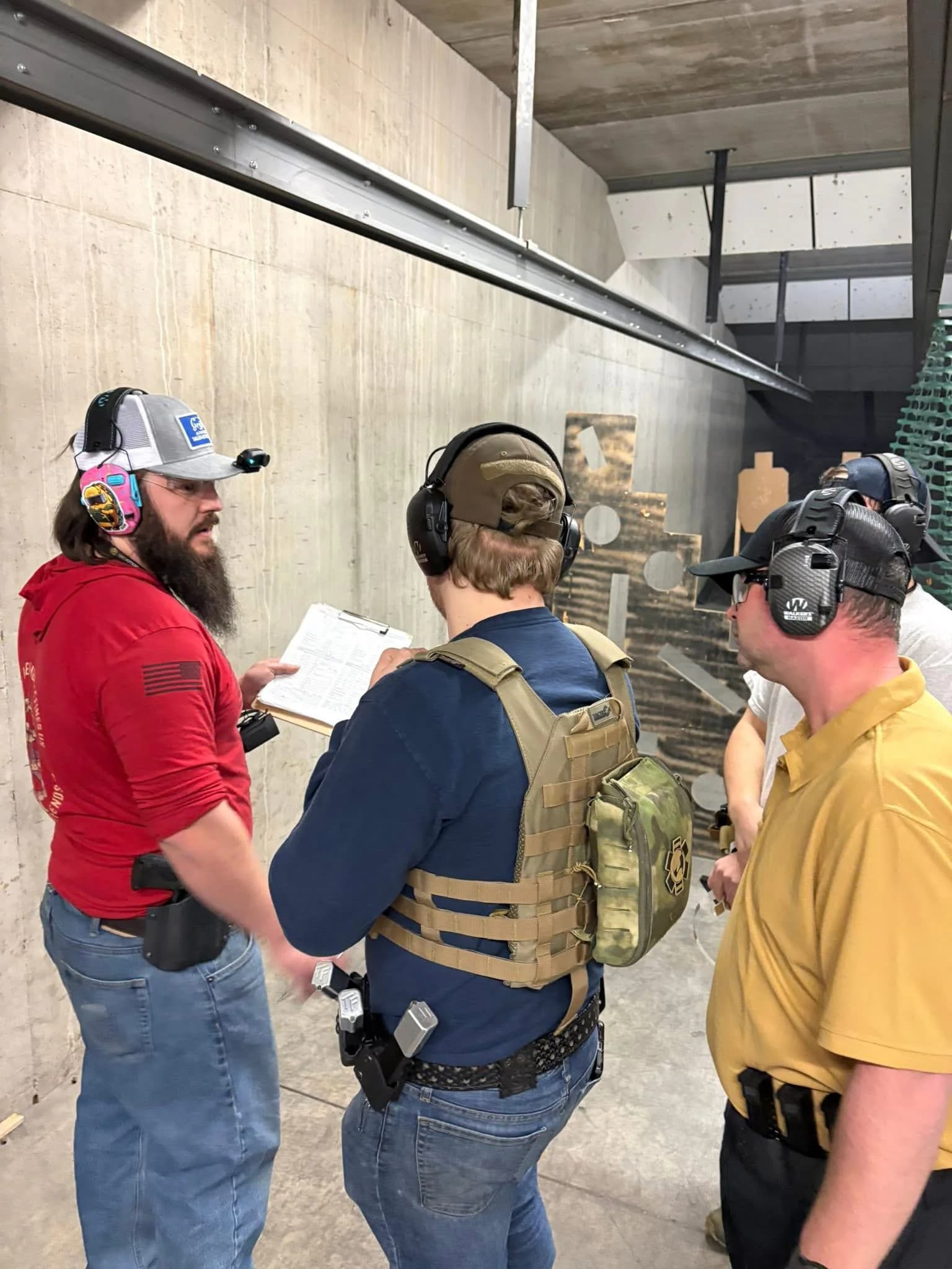 A Marc-On instructor briefing shooters before a range exercise