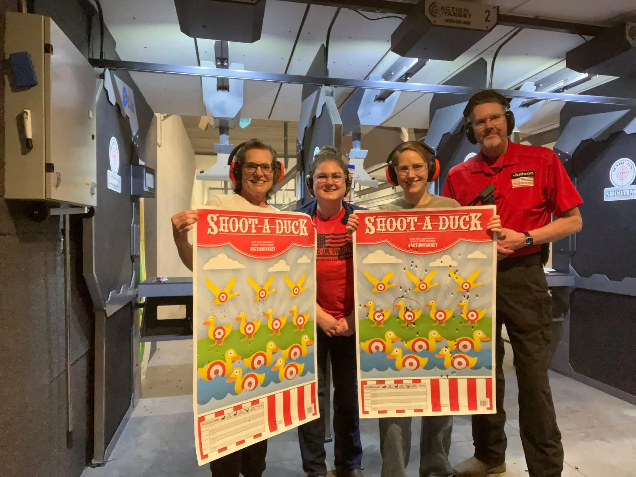 Four Marc-On shooters holding their completed Shoot-A-Duck targets